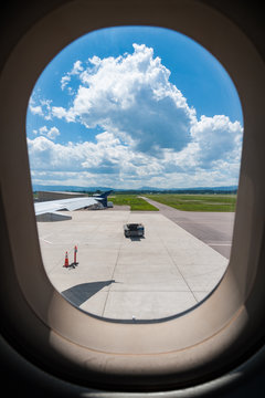 View of airport seen through plane window
