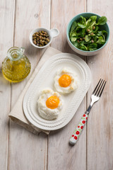 owen eggs eith salad capers and olive oil