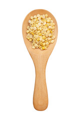 Split soybean on wooden spoon isolated on white background with clipping path.