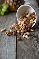 Nuts mix over wooden background. Energy super food. Proteine food. dieting, healthy food. Isolated nuts - almonds, hazelnuts,cashew, brazil nuts.