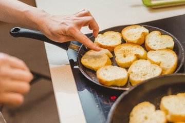 Pumpkin sandwiches with white cream cheese and green avocado on a fresh baguette - home recipe for making bruschetta
