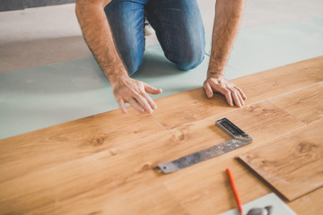 Finishing work at home - laying a new laminate flooring