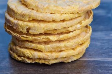 stack of corn wafers on a brown wooden surface