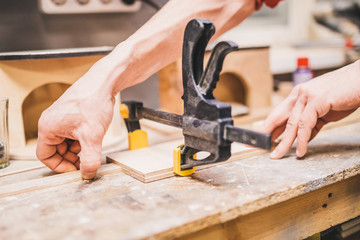 Carpentry workshop - work with clamps - fixing and gluing