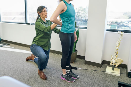 Physiotherapist assisting her patient during exercise