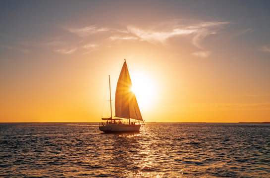 Sailing yacht in the ocean at sunset