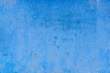 Texture of old battered concrete wall of blue color