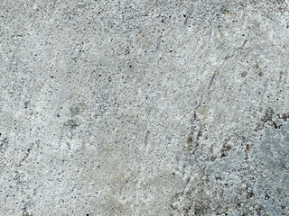 mur en béton gris recouvert de traces