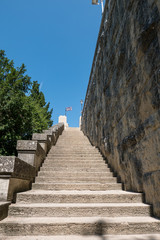 Fototapeta premium Stairway uphill with signs at the end