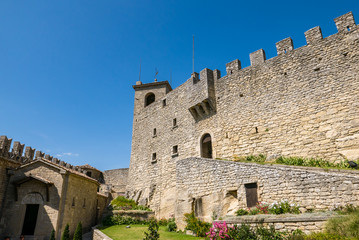 Fototapeta na wymiar Tourists visit the fortress known as Guaita or Rocca in San Marino.