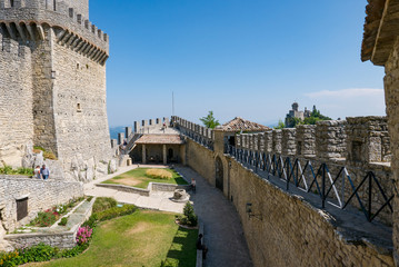 Fototapeta na wymiar Tourists visit the fortress known as Guaita or Rocca in San Marino.