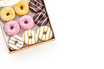 Modern design with donuts in box on white background top view space for text