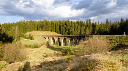 mountain landscape. with old viaduct bridge in Vorohta, Ukraine. Carpathian Mountains.