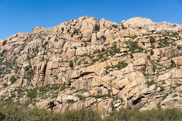 Fototapeta premium Panoramic view of granite rocks in La Pedriza, National Park of mountain range of Guadarrama in Manzanares El Real, Madrid, Spain.
