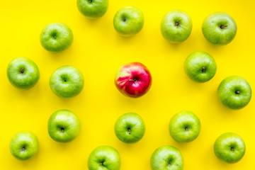 food pattern with green apples on yellow background top view