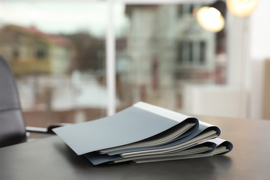 Stack of folders with documents on office table. Space for text
