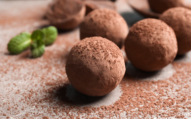 Fototapeta na wymiar Delicious raw chocolate truffles on grey background