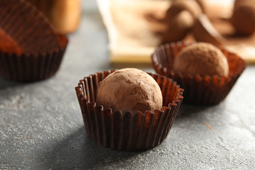 Tasty chocolate truffles on grey background, closeup