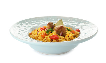 Plate with rice pilaf and meat on white background