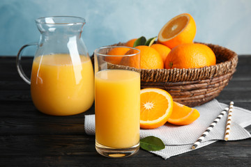 Fototapeta na wymiar Composition with orange juice and fresh fruit on table