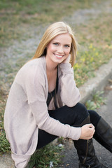 pretty girl sitting on curb