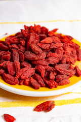 Healthy superfood, red dried goji chinese wolfberry berries, used in many snack foods and supplements, granola bars, yogurt, tea blends, fruit juice as whole berries or ground seeds, seed oil.