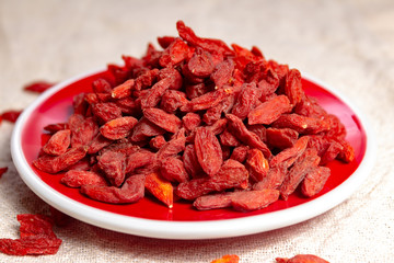 Healthy superfood, red dried goji chinese wolfberry berries, used in many snack foods and supplements, granola bars, yogurt, tea blends, fruit juice as whole berries or ground seeds, seed oil.