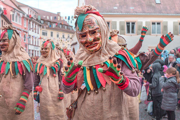 Friendly carnival figure with costume of sack cloth. Street Carnival in Southern Germany - Black Forest.