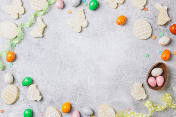 sugar easter cookies with colorful chocolate shape of eggs candy