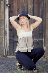 Cute young lady being silly with hat