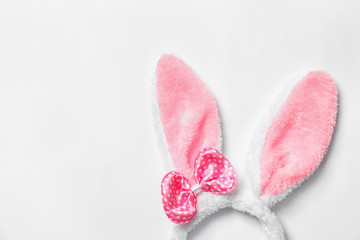 Funny headband with Easter bunny ears on white background, top view