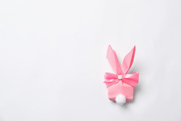 Creative Easter bunny gift bag on white background, top view