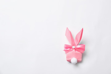 Creative Easter bunny gift bag on white background, top view
