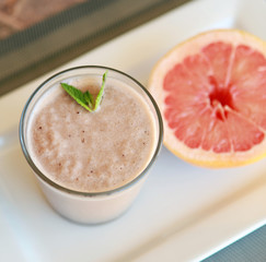 Breakfast plate with chocolate protein shake and grapefruit