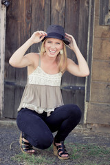 Cute young lady laughing with hat