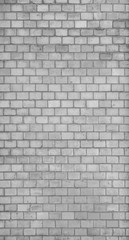Full frame background of detailed old brick wall in black and white.