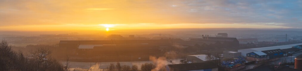 Aerial panorama of an early sunrise over Sheffield city, South Yorkshire, UK  on Christmas Day 2018