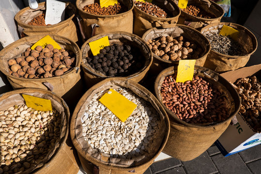 Top view on the baskets full of nuts at Levinsky spice market, Tel-Aviv. Israel 2018.