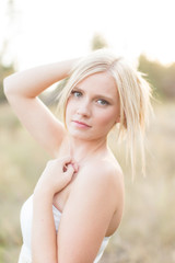 gorgeous young girl holding hair off shoulders