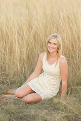 young woman in wheat field