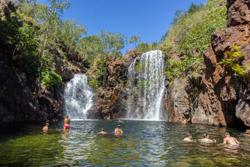 Tourists and residents enjoy refreshing swim at Florence Falls, very popular desitination for tourists and locals alike, Litchfield National Park, Northern Territory, Australia