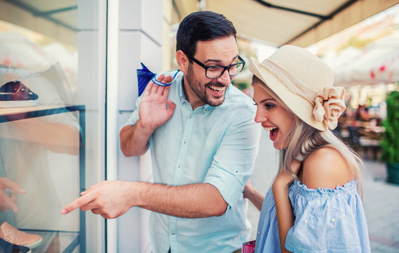 Young couple in shopping. Consumerism, love, dating, lifestyle concept
