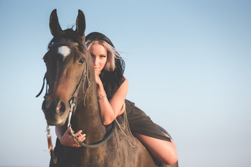 Arabian horse, a girl, and the desert