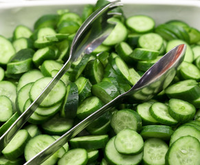 .sliced â€‹â€‹cucumbers and spoon