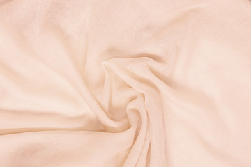 delicate soft and wrinkled fabric cream color background texture