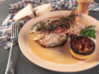 Roasted sea bass with beur Noir sauce and caramelized lemon