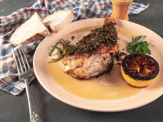 Roasted sea bass with beur Noir sauce and caramelized lemon