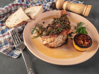 Roasted sea bass with beur Noir sauce and caramelized lemon