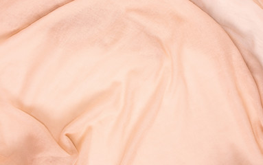 delicate soft and wrinkled fabric cream color background texture