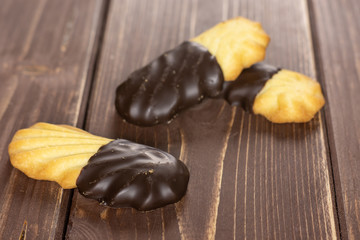 Group of three whole lazy cookie with chocolate on brown wood